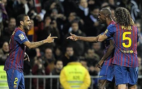 Alves Abidal and Puyol celebrate the second goal