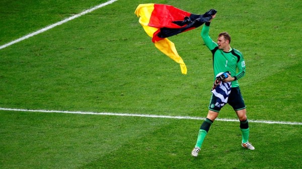 Manuel Neuer holds the German flag