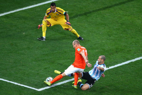 Masherano prevents Arjen Robben from scoring in the 2014 World Cup semi-final